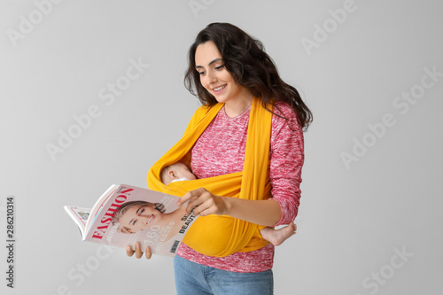 Young mother with little ba...