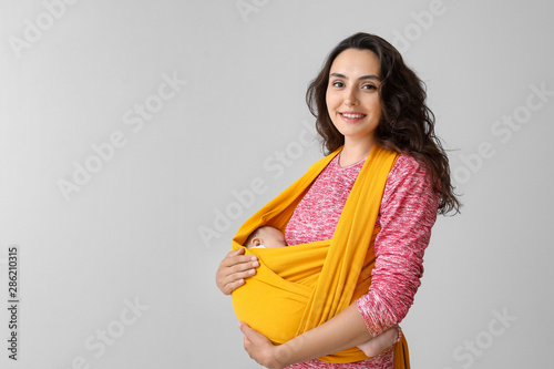 Young mother with little ba...