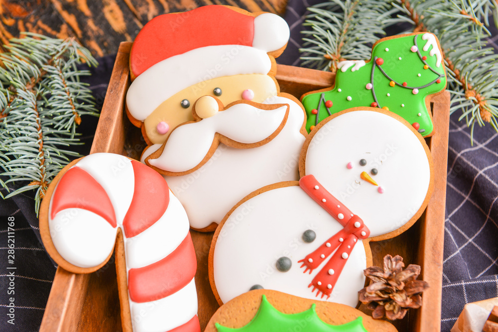 Tasty Christmas cookies in box, closeup