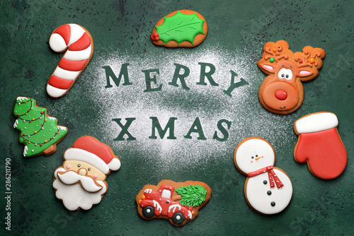 Composition with tasty Christmas cookies on color background