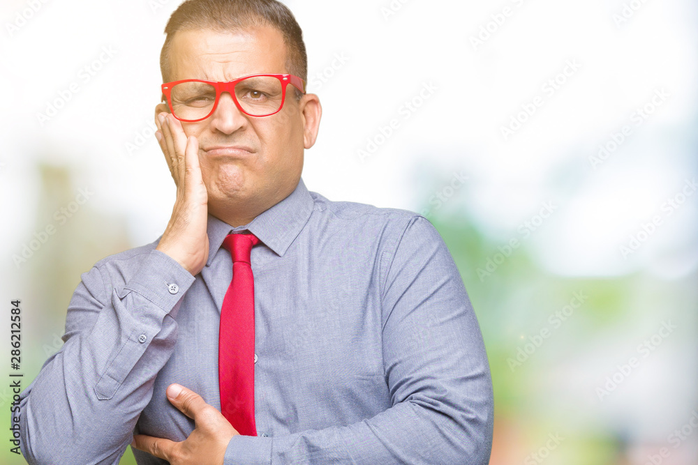 Middle age arab man wearing fashion red glasses over isolated background thinking looking tired and bored with depression problems with crossed arms. Middle age arab man wearing fashion red glasses over isolated background thinking looking tired and bored with depression problems with crossed arms.
