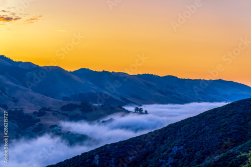 Panorama at Sunset with Cloud-filled Valley