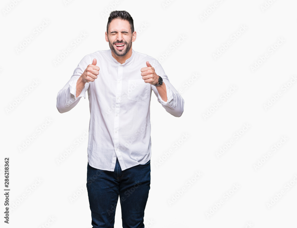 Young business man over isolated background excited for success with arms raised celebrating victory smiling. Winner concept. Young business man over isolated background excited for success with arms raised celebrating victory smiling. Winner concept.