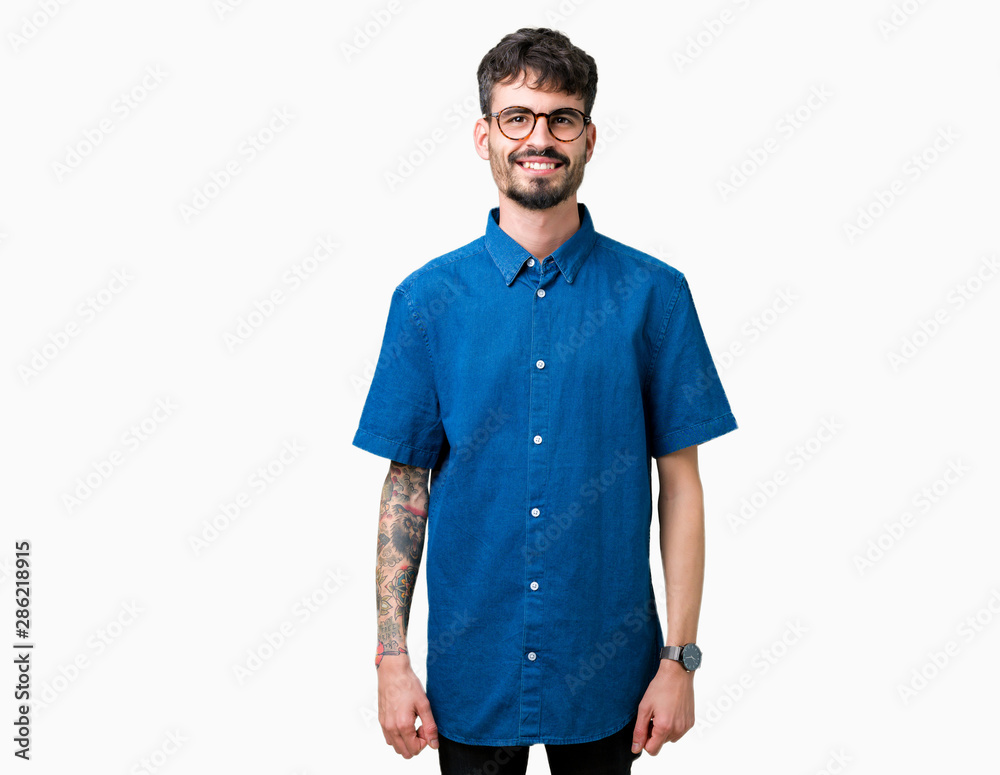 Young handsome man wearing glasses over isolated background with a happy and cool smile on face. Lucky person. Young handsome man wearing glasses over isolated background with a happy and cool smile on face. Lucky person.