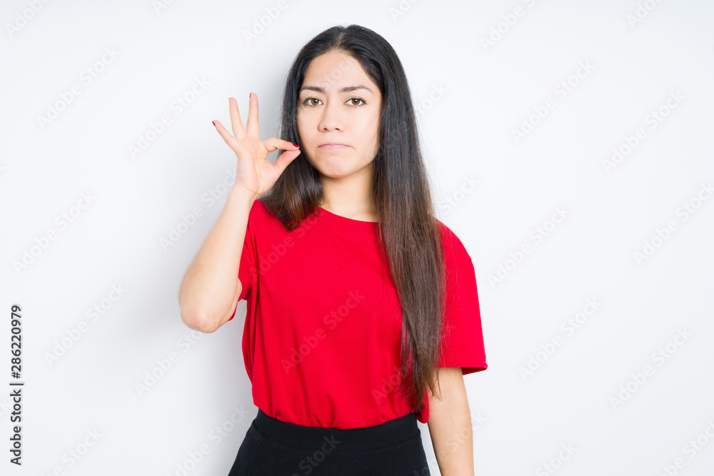 Beautiful brunette woman wearing red t-shirt over isolated background mouth and lips shut as zip with fingers. Secret and silent, taboo talking Beautiful brunette woman wearing red t-shirt over isolated background mouth and lips shut as zip with fingers. Secret and silent, taboo talking