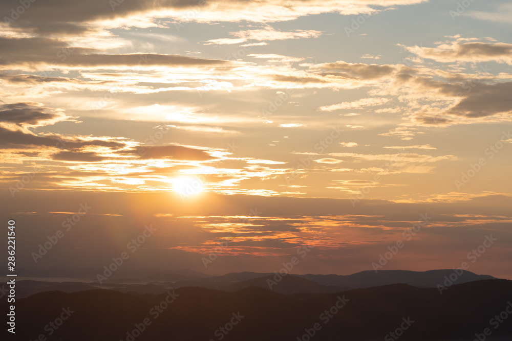 Fototapeta premium Sun Breaks Through Clouds Over Smokies