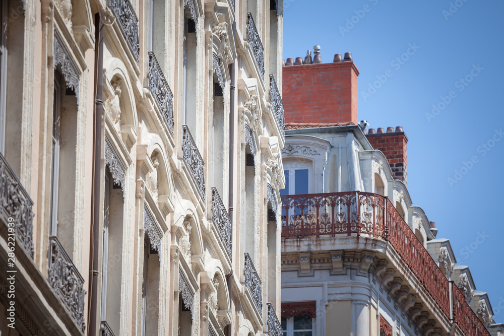 Typical Haussmann style facades, from the 19th century, traditional in the city centers of French cities such as Paris and Lyon, with their traditional stone facades and windows