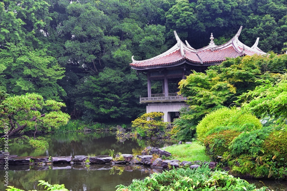 Traditional Japanese gardens in public parks in Tokyo, Japan. Views of stone lanterns, lakes, ponds, bonsai and wildlife walking around paths and trails. Asia. Traditional Japanese gardens in public parks in Tokyo, Japan. Views of stone lanterns, lakes, ponds, bonsai and wildlife walking around paths and trails. Asia.