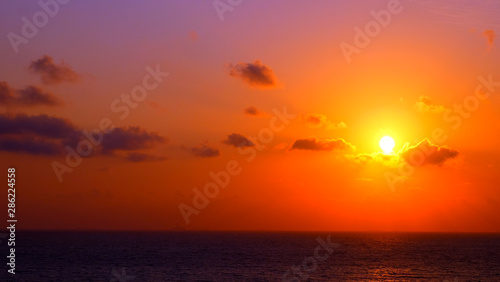 Beautiful sunrise at the beach © taffpixture