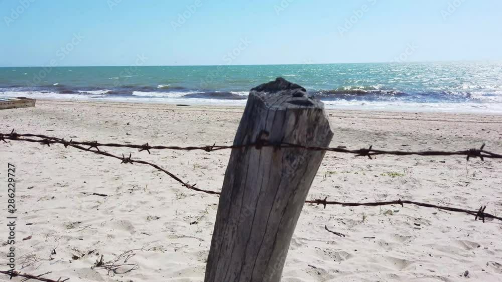 fence of barbed wire at the seashore fence of barbed wire at the seashore