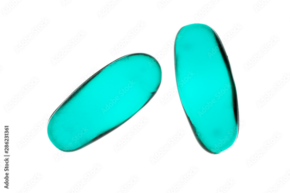 Bad shape expired blue pills on background Bad shape expired blue pills on background