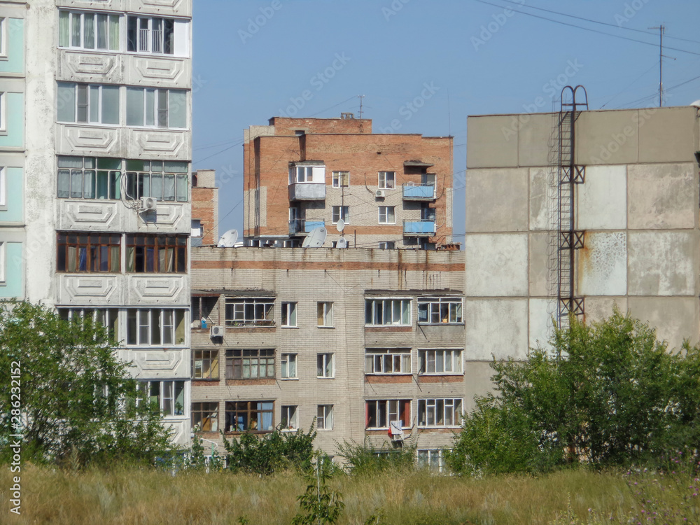 Apartment buildings. Ust-Kamenogorsk (Kazakhstan). Cityscape. Urban architectural background. Old and New. Abstract landscape. Residential area