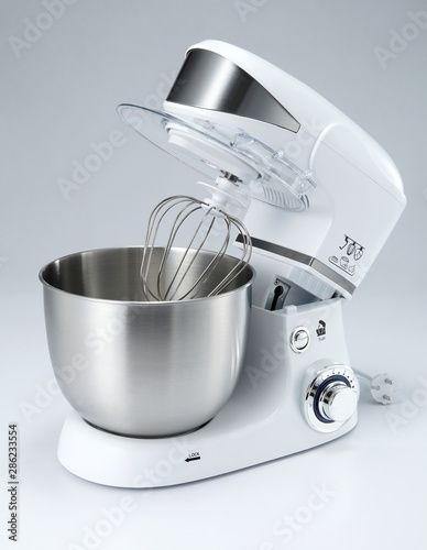 A mixer, hand mixer or stand mixer, is a kitchen device that uses a gear-driven mechanism to rotate a set of "beaters" in a bowl containing the food or liquids to be prepared by mixing them.