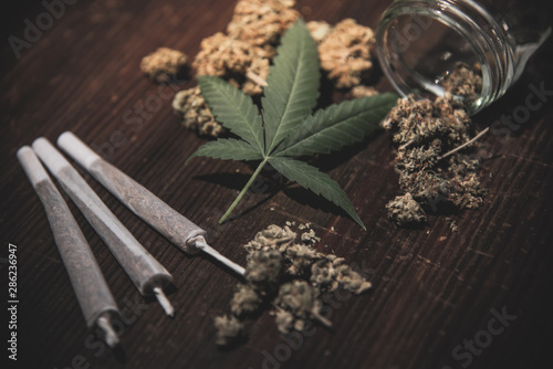 Close up of medical marijuana buds on wooden background photo