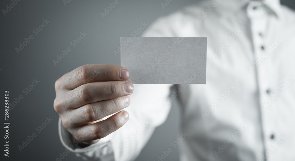 Businessman showing empty business card. Businessman showing empty business card.