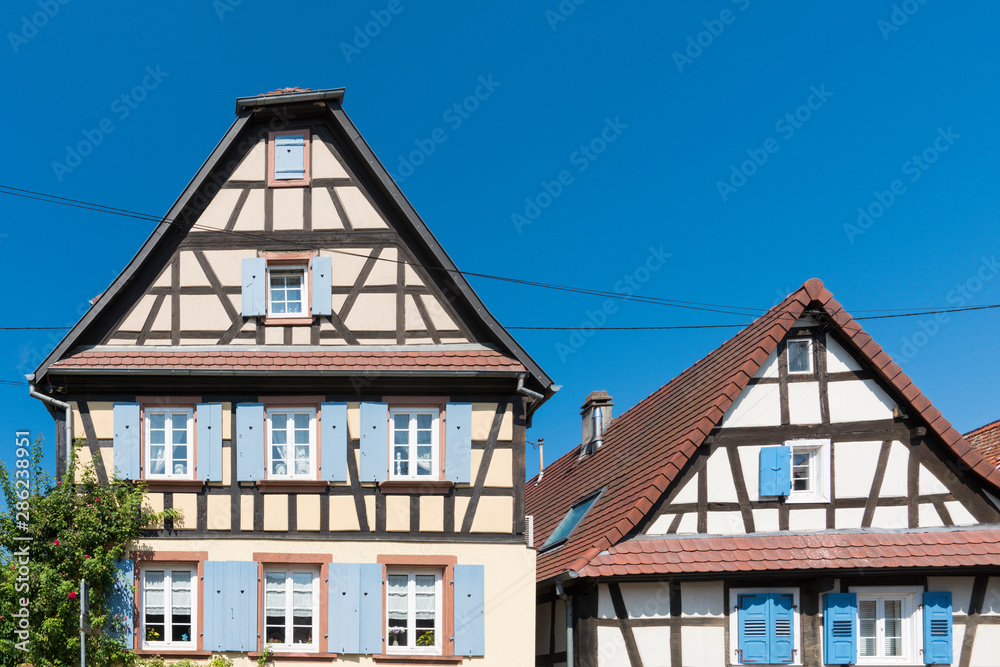 half timbered houses with blue shutters in Riedseltz. France