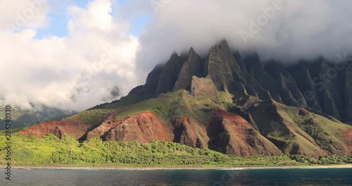 Na pali coast and beach of Kauai Hawaii. View from water of famous Hawaiian travel destination. Napali coastline in Kaui, Hawaii, USA, the Honopu arch.