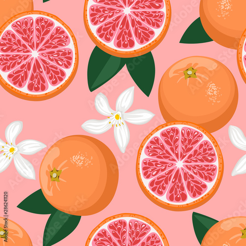 Seamless pattern with bright grapefruits, with white flowers and green leaves on pink background. Vector illustration of juicy citrus fruits in cartoon simple flat style.