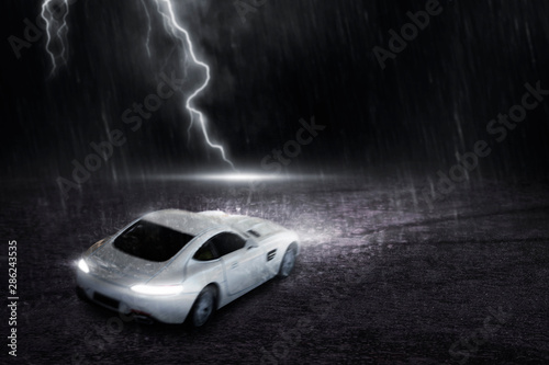The white sports car that focuses on the back, runs on a road with rain and lightning at night, motion blur concept. 3D Render. photo