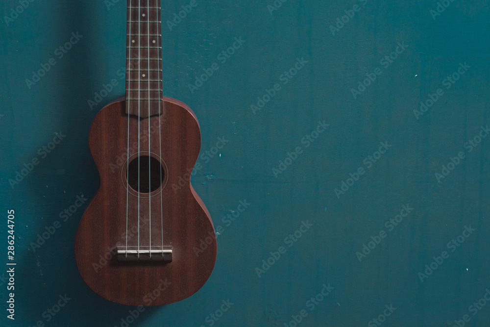 ukulele on close up isolated blue background