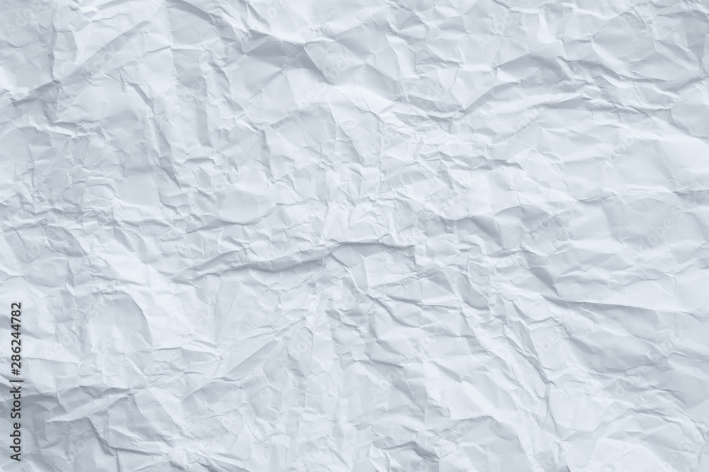 Fototapeta premium Blue toned white wrinkled paper. Aged surface design. Abstract art background. Copy space.