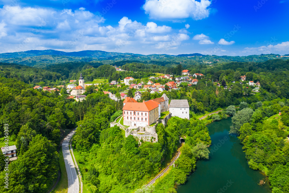 Panoramic view of the river Kupa and Ozalj Castle in the town of Ozalj, Croatia, drone aerial shot