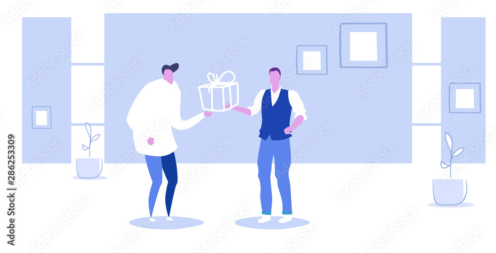 Obraz premium Businessman receiving wrapped gift box from male