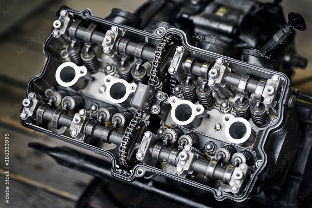 Motorcycle four-cylinder engine during repair at the service. Motorcycle four-cylinder engine during repair at the service.