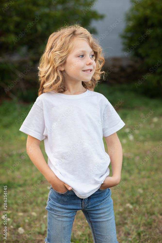 Fototapeta premium Funny blond kid with long hair