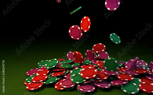 3d rendering of coulored casino chips falling on a green table. Black background photo