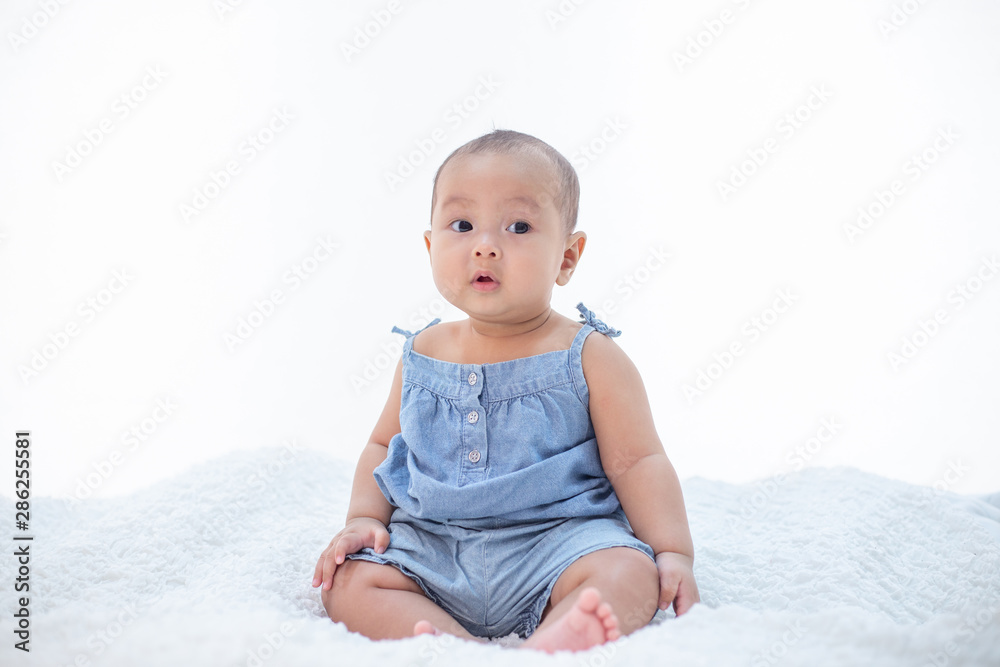 The little boy sitting on the bed The little boy sitting on the bed