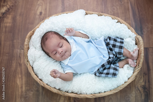 Newborn baby lying in the basket