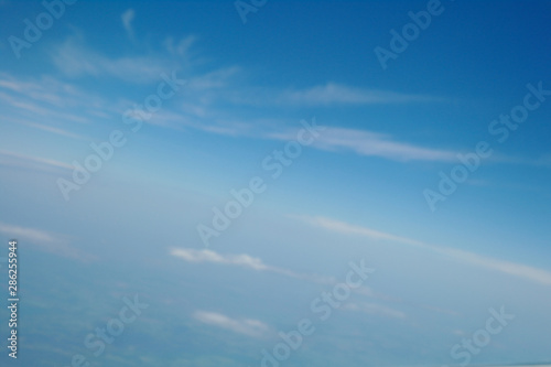 Obraz na płótnie clouds and blue sky seen from plane w salonie
