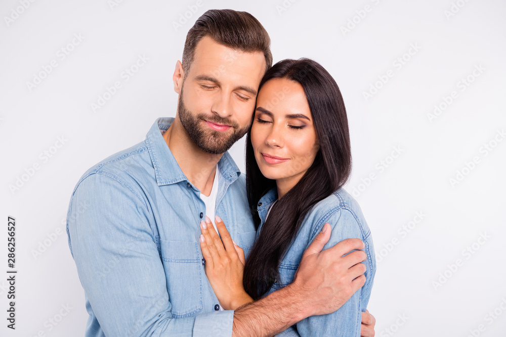 Portrait of charming people having long hair closed eyes hugging isolated over white background Portrait of charming people having long hair closed eyes hugging isolated over white background