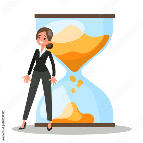 Businesswoman standing at the big hourglass. Idea of time