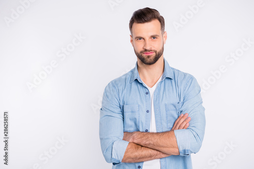 Portrait of his he nice-looking attractive lovely masculine bearded guy folded arms isolated over light white pastel background © deagreez