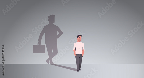 casual guy dreaming about being businessman shadow of business man with briefcase imagination aspiration concept male cartoon character standing pose full length flat horizontal