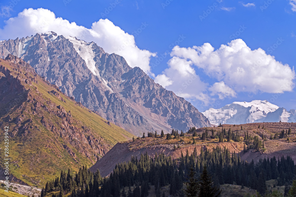 View of the beautiful Left Talgar mountain valley with river, rocks and forest in Tian Shan mountains near Almaty city; best place for active lifestyle, hiking and trekking in Kazakhstan.