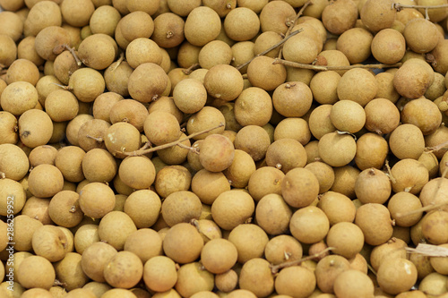 Thai fruit longan background. Longan exotic fruit for sell in street market, Thailand, close up, top view photo