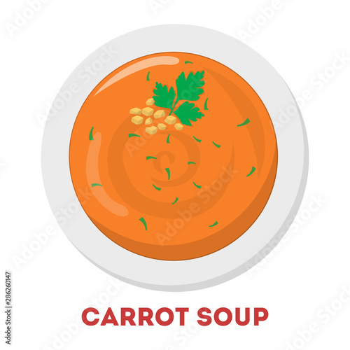 Carrot soup in a bowl. Tasty dinner in the white plate