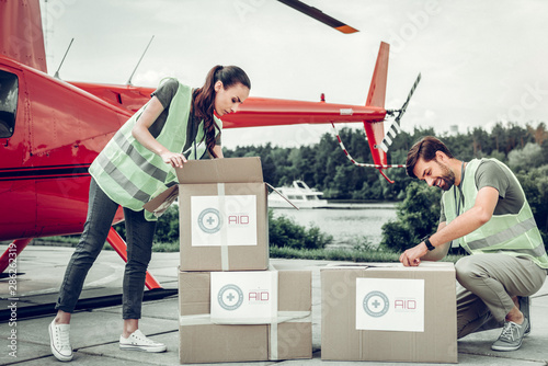 Humanitarian workers unpacking boxes after receiving them photo