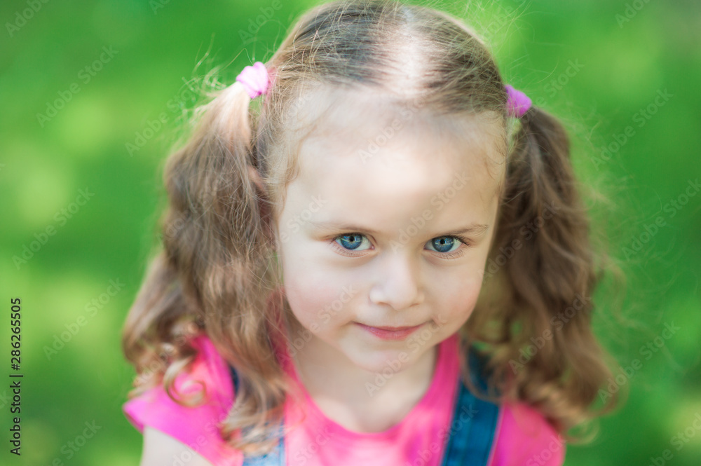 Portrait of a happy liitle girl with blue eyes close-up Portrait of a happy liitle girl with blue eyes close-up