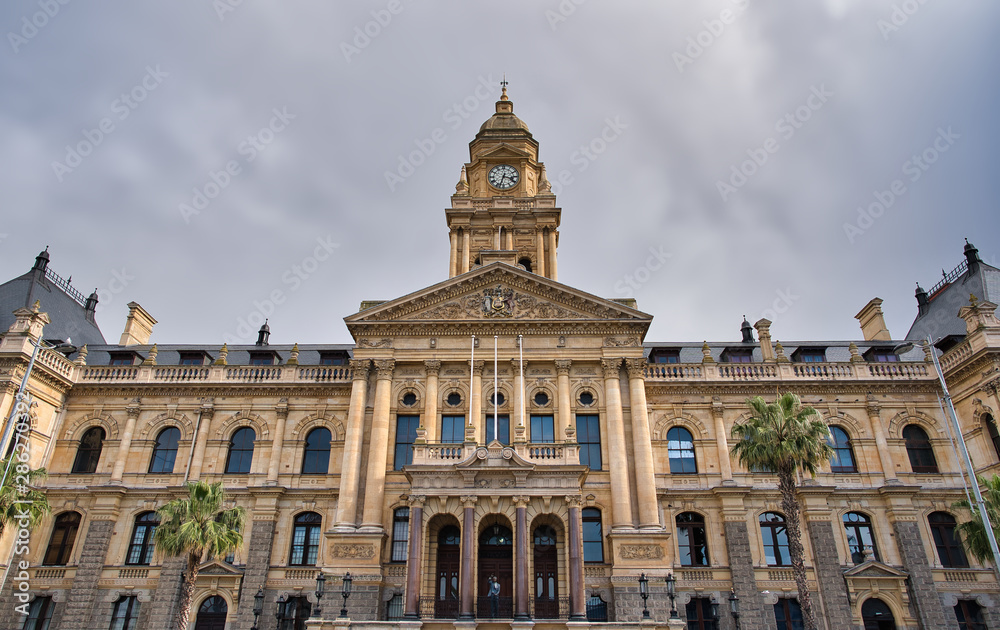 Fototapeta premium Historic Cape Town City Hall Facade Under Cloudy Sky, South Africa