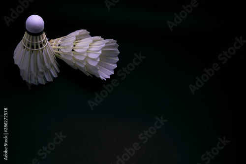 Badminton shuttlecock on black background.