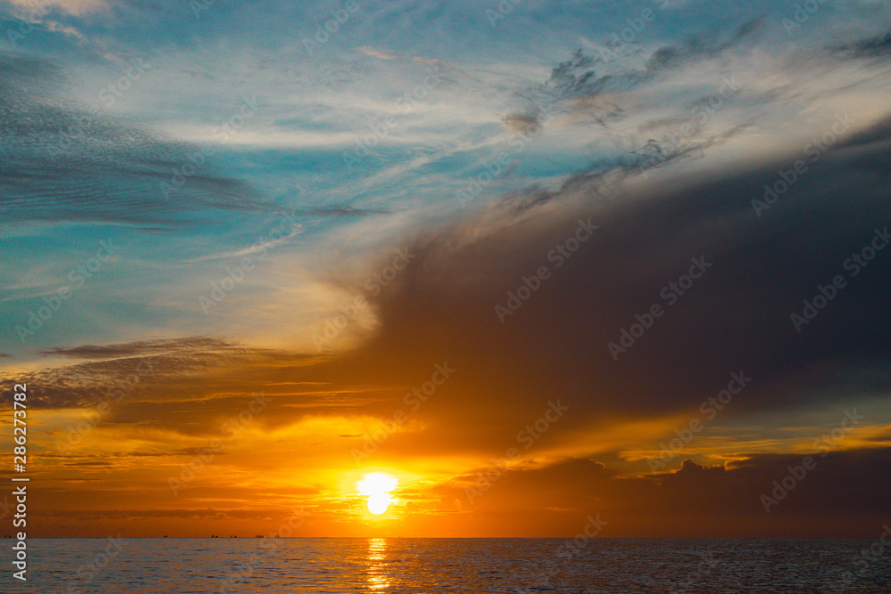 Beautiful sunrise with dramatic cloud and blue sky