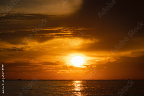 Beautiful sunrise on the sea. Low key of image.