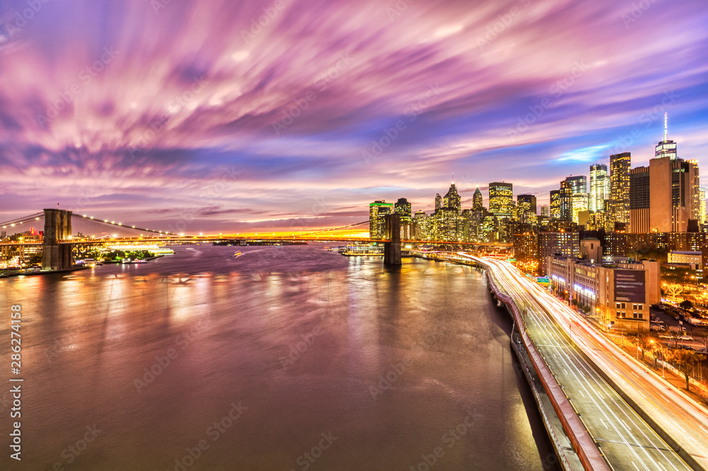 View of Lower Manhattan with Brooklyn Bridge at Sunset, New York City