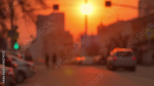 Skyline, urban road and buildings at sunset. Evening urban landscape.