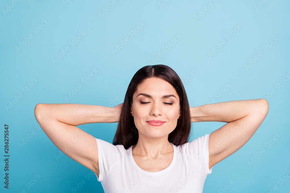 Photo of relaxing carefree cute funny funky happy girl having fun rest with hands holding her head while isolated with blue background Photo of relaxing carefree cute funny funky happy girl having fun rest with hands holding her head while isolated with blue background