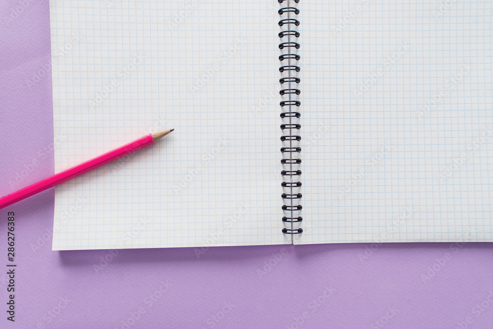Education concept - pink pencil close up and opened notebook for educational new academic year begin or study.Back to school. Copy space Education concept - pink pencil close up and opened notebook for educational new academic year begin or study.Back to school. Copy space